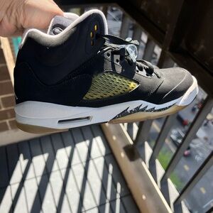 Jordan Black and Gold Sneakers with Signature Design